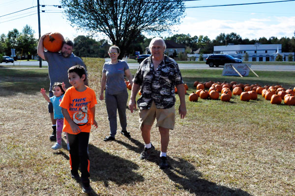 John - the muscle man with a big pumpkin